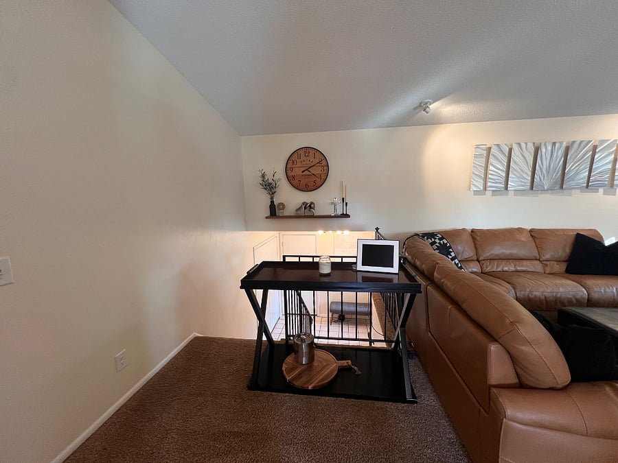 Entry way to upstairs living. Access to 2 stall garage and front patio.