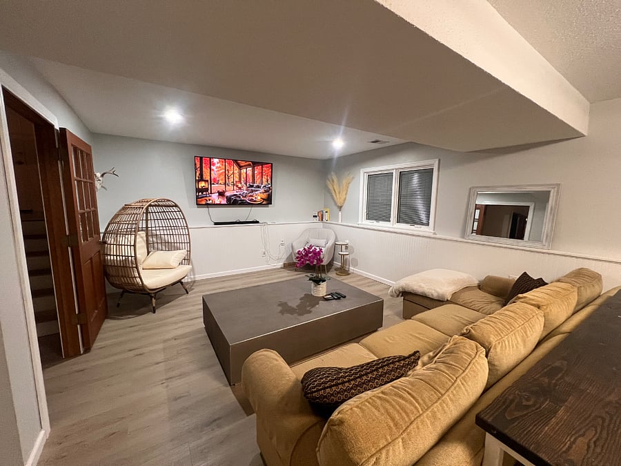 Downstairs living room. Plenty of seating and large TV.