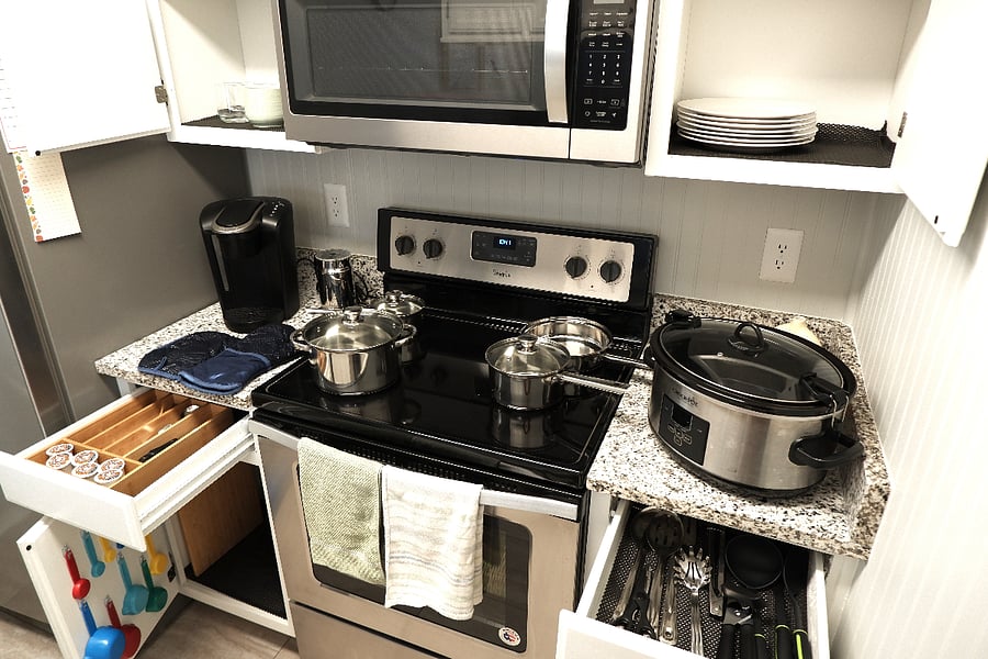 Kitchen appliances include Keurig Coffee machine, Crock pot and household necessities. 