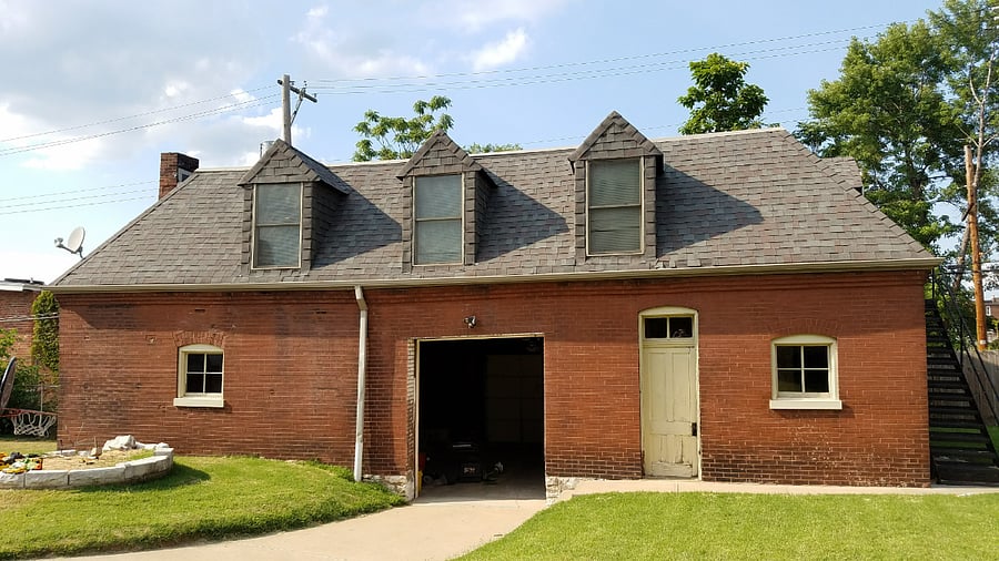 Exterior view of the full carriage house. Garage parking located directly below the apartment for easy access.