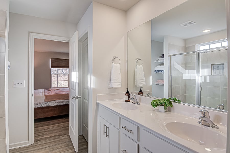 Master Suite with walk-in dressing room and bathroom with walk-in shower