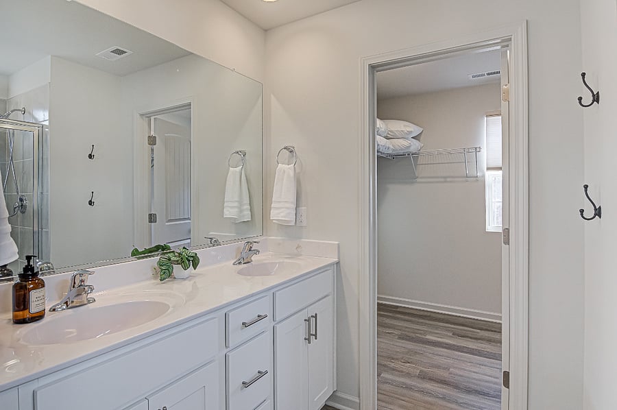 Master Suite with walk-in dressing room and bathroom with walk-in shower
