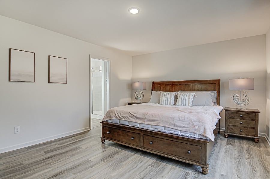 Master Suite with walk-in dressing room and bathroom with walk-in shower