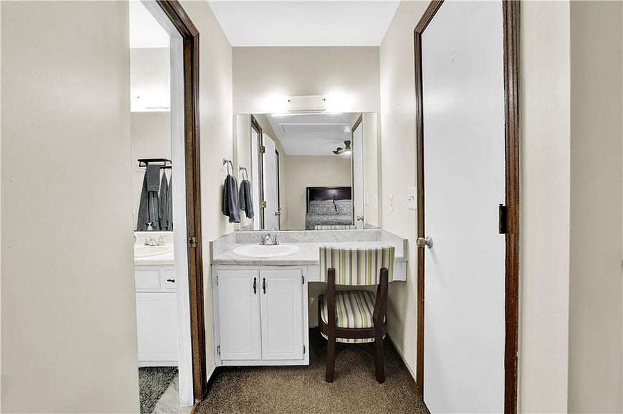 Master bedroom has a vanity/sink.