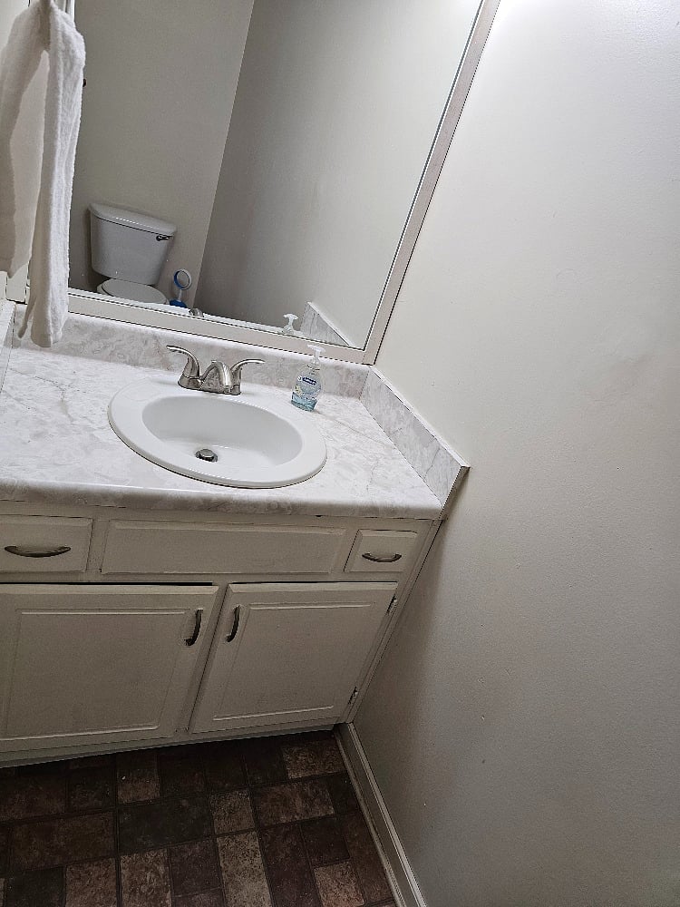 Half bath located off the kitchen