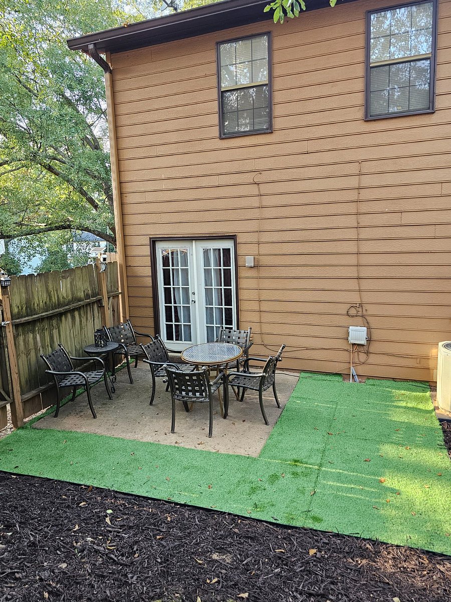 Cozy patio with seating for 6 and solar lighting for relaxing evenings outside.