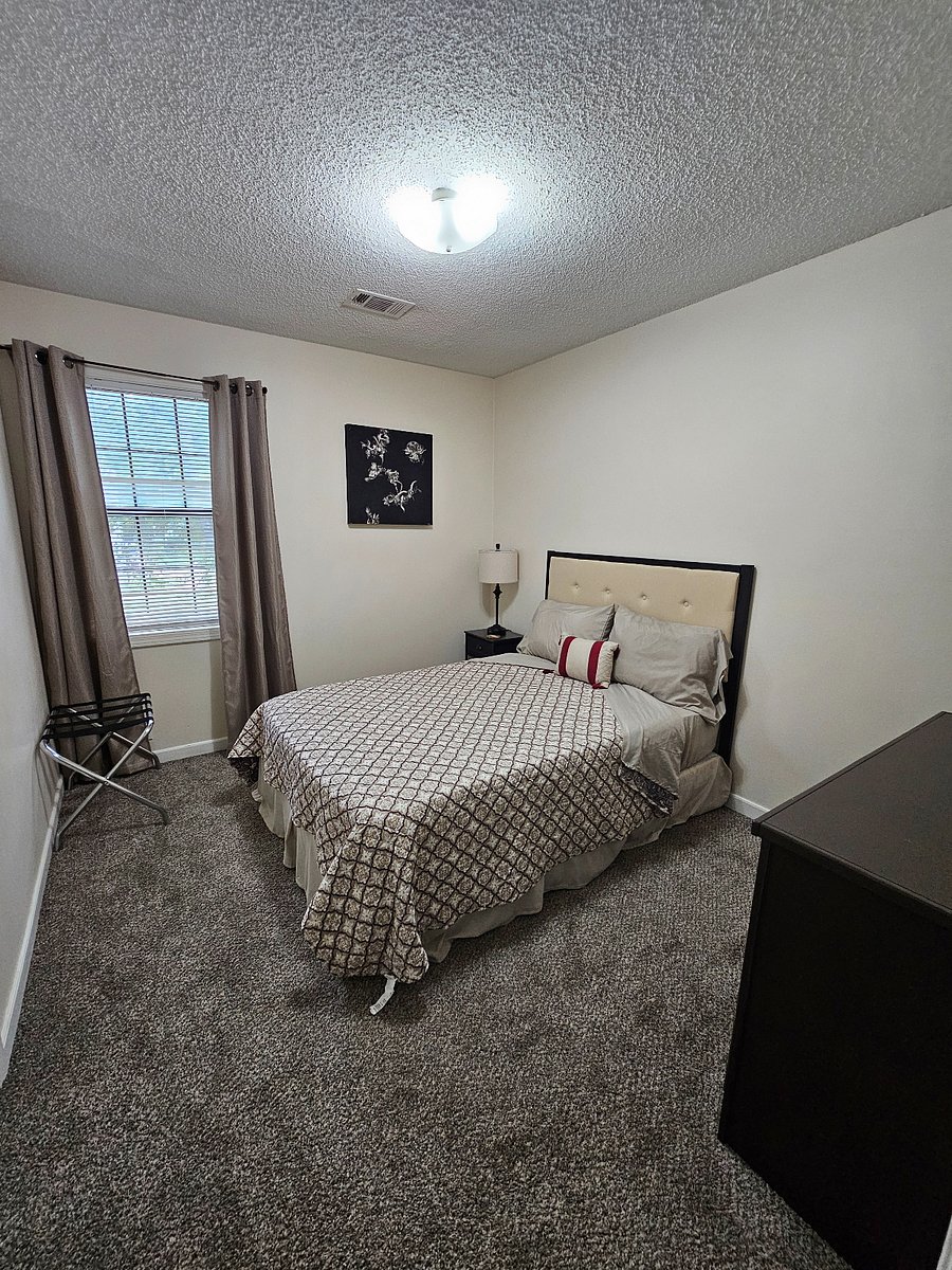 Third bedroom with charging port in the lamp to charge your phone while you sleep.