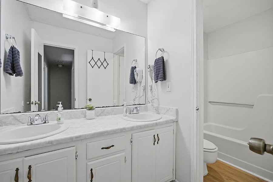 Full bath has double sinks.