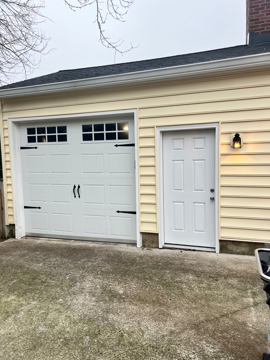Private Garage Door Entrance to steps leading down to apartment