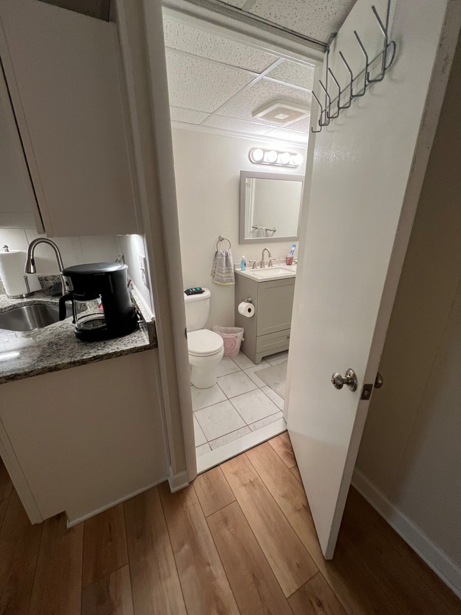 Private Bathroom to the right of kitchen sink