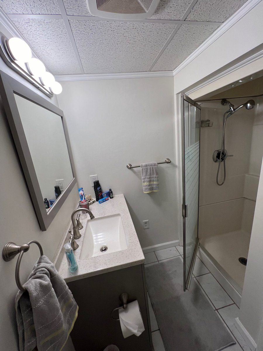 Bathroom sink with full shower