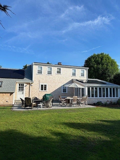 Back of our Home with large Patio, Fire Pit, Outdoor Dining Furniture and Weber Gas Grill