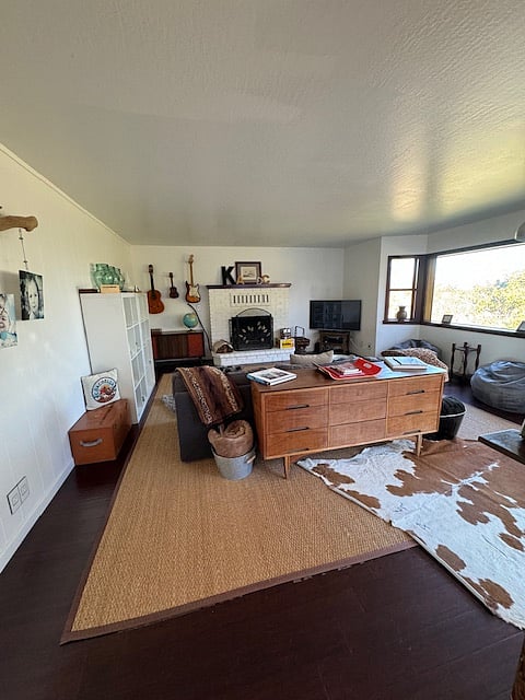 Living room with functioning fireplace with views of Mount Saint Helena.