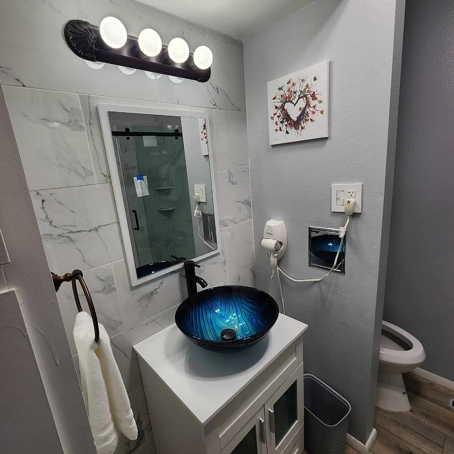 Bathroom with hairdryer.