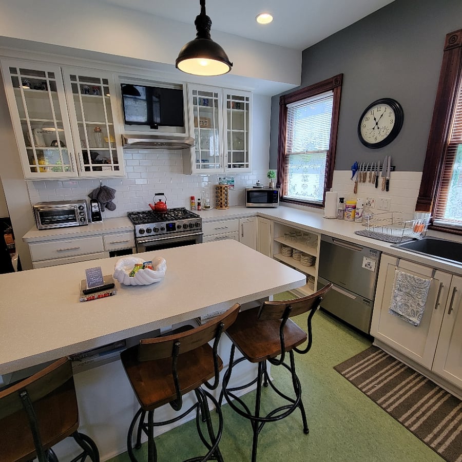 Spacious kitchen with lots of prep space for cooking. It has a gas stove, microwave and toaster oven.