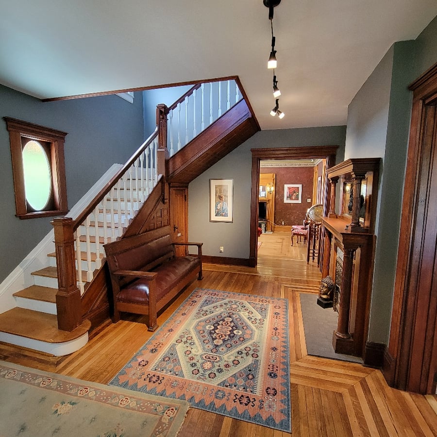 The entry way leading upstairs and into the living/dining room. The gallery is reachable from this area as well.