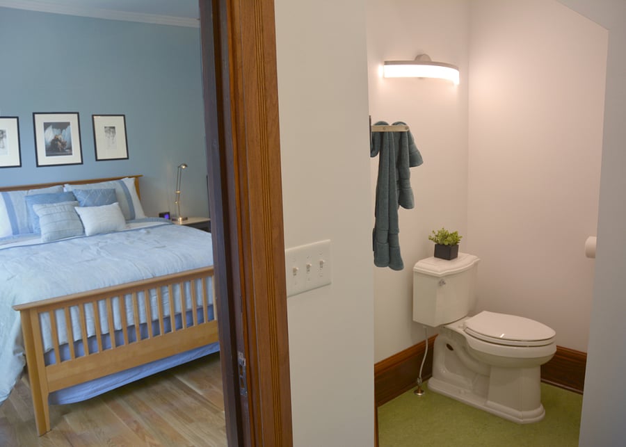 A view of the blue room bedroom area from the private en-suite full bathroom. 