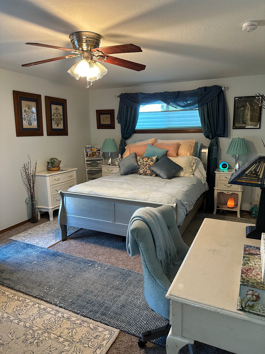 Queen bed. Numerous pillows. Soft bedding. Versatile window shades.