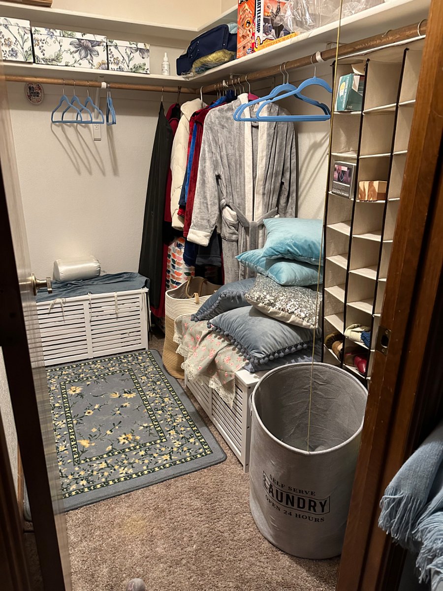 Walk-in closet with hangers.