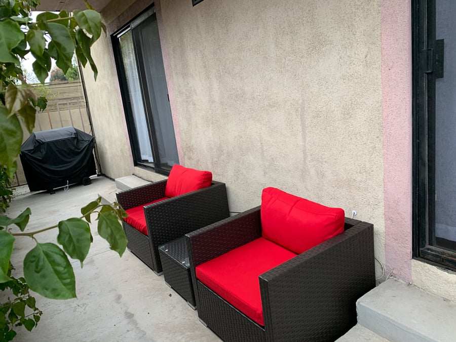 Small out door patio with gas grill.