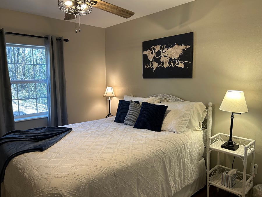 Cozy bedroom with view of the forest