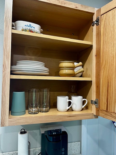 Fully stocked with plates, bowls, mugs