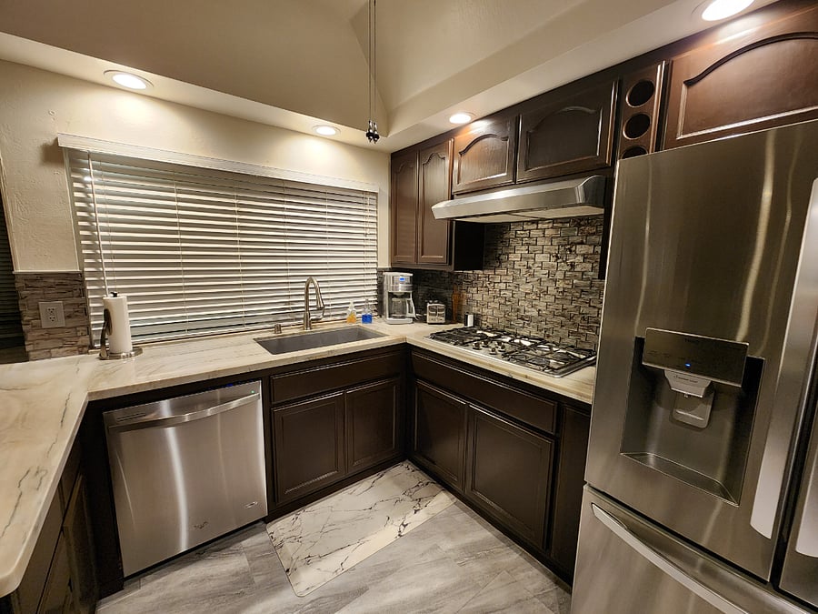 Kitchen with gas cooktop, dishwasher, extra large sink, refrigerator, with filtered water and ice. Also has toaster and coffee maker (with bean grinder).