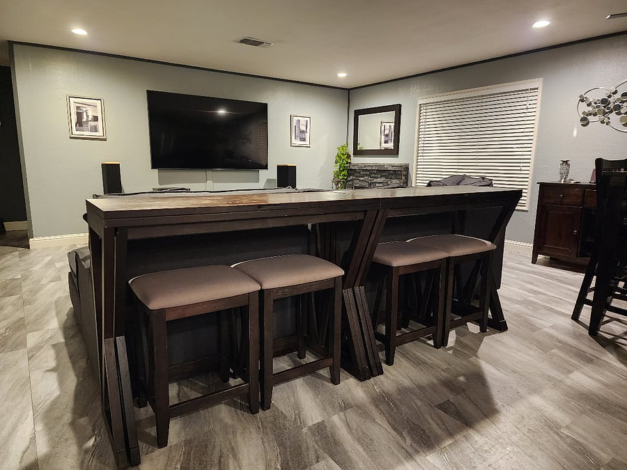 In addition to the dining table that seats 6, there is this couch table that you can sit at to eat while watching TV or work on your laptop. The couch table folds open to double in size.
