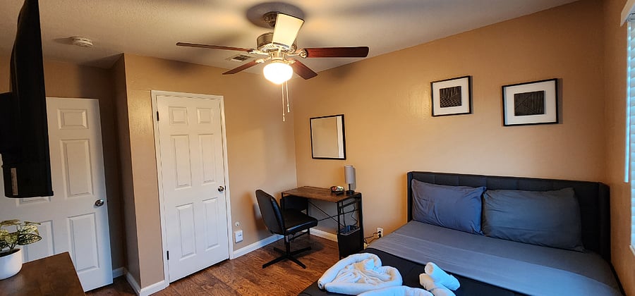 Bedroom #3 - Double size bed, ceiling fan, smart TV, desk, closet, and dresser.