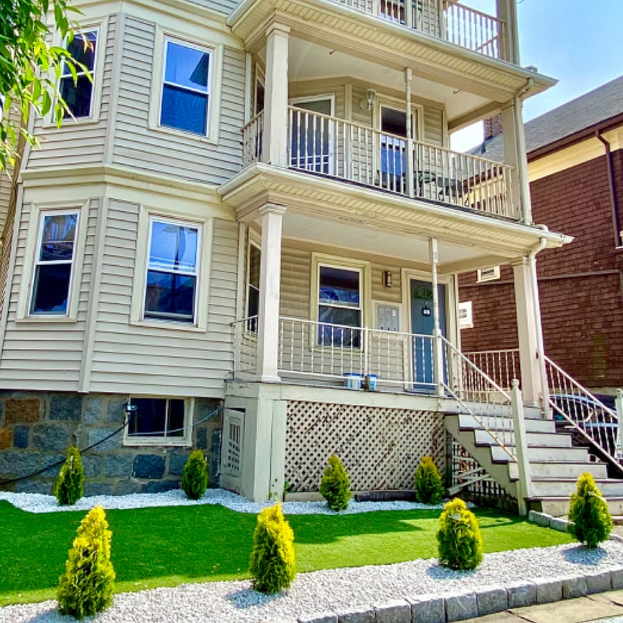 beautifully turfed-landscaped front yard