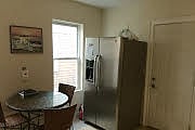 Kitchen - eat-inkitchen and full stainless steel fridge/freezer with a water and ice maker.