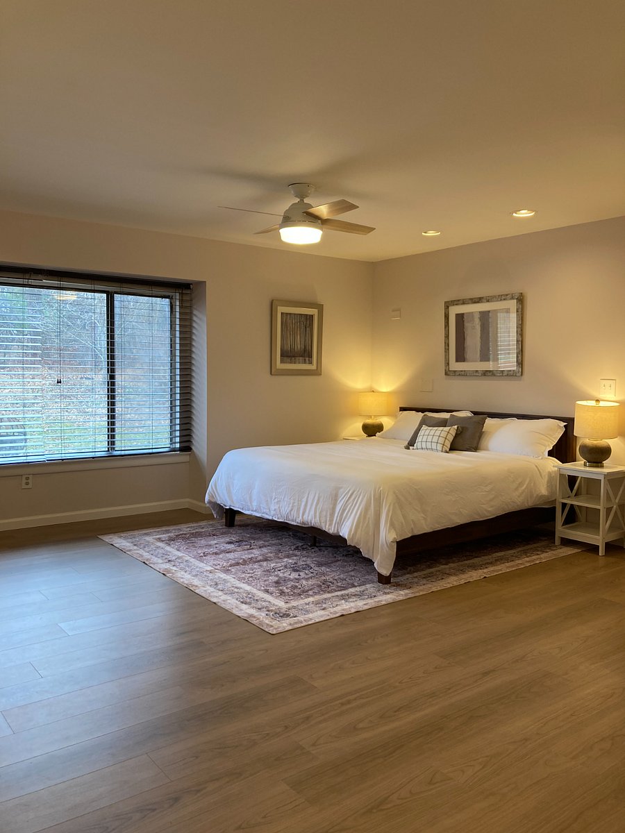 Primary bedroom with a king size bed in the sleeping area