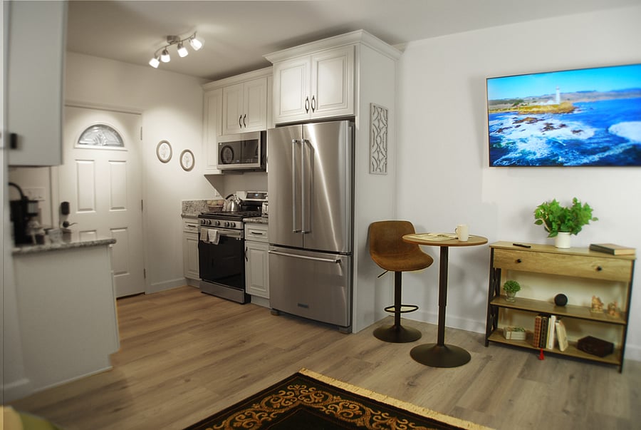Kitchenette includes full-size refrigerator, stove, microwave, utensils, pots, pans, coffee maker, air fryer and toaster.