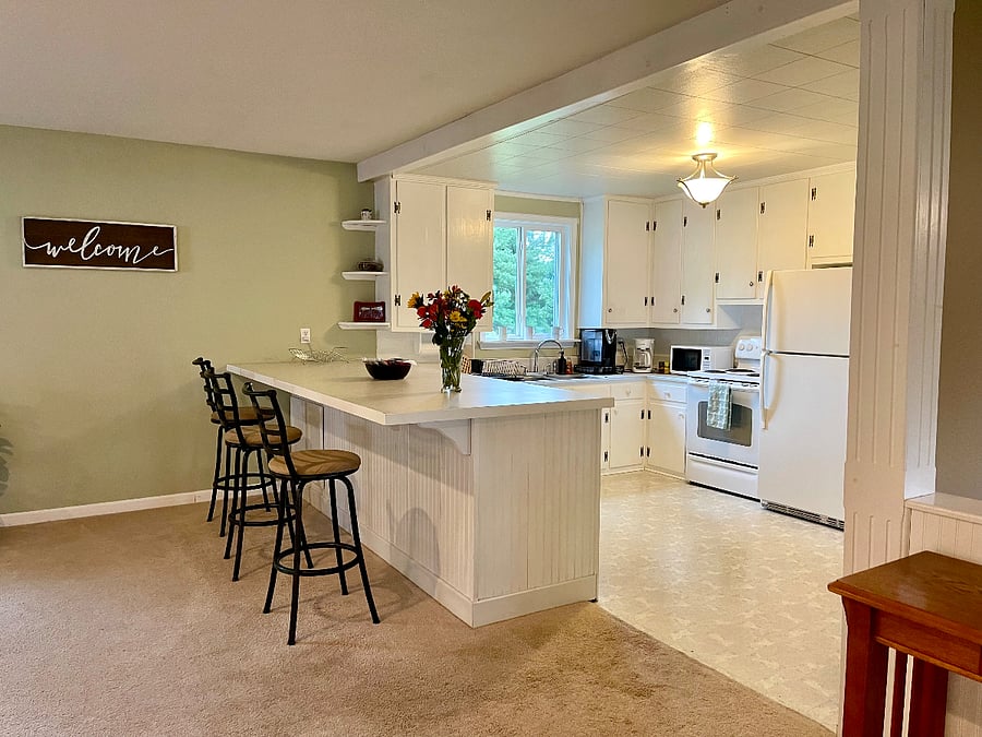 A classic country kitchen is well stocked and includes a full sized fridge, microwave, dishware, and about any gadget or pan you'll need to enjoy fixing meals.  (Note: There is no dishwasher.)