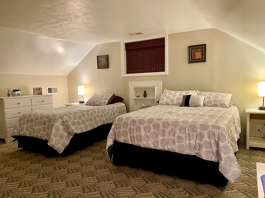 East, upstairs bedroom has one Sleep Number twin XL bed and one full sized bed.