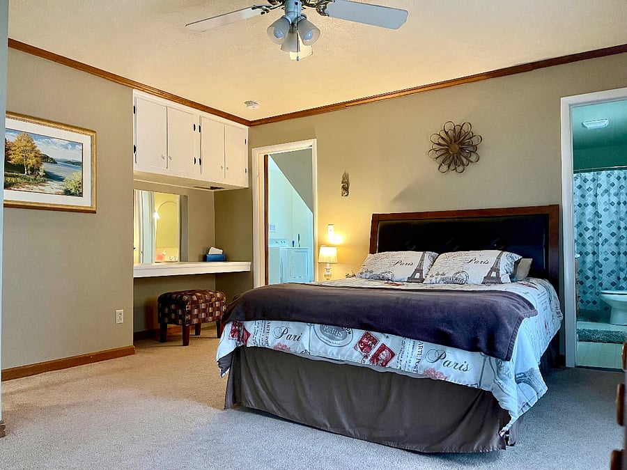 Comfy master suite offers a queen sized bed, its own bath with tub/shower combo, walk-in closet, and desk or vanity area!