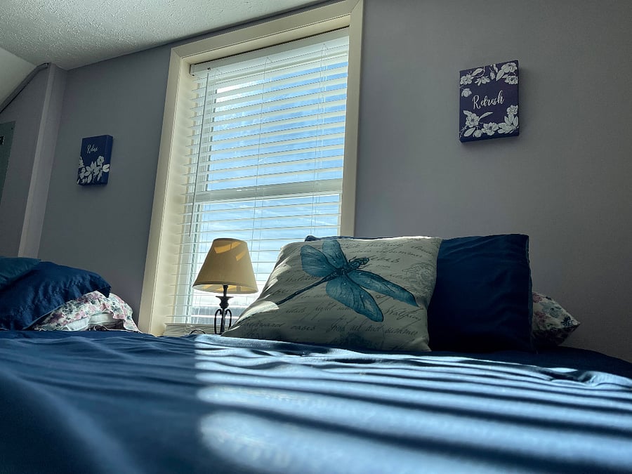 West, upstairs bedroom is warm and cozy with two twin beds.