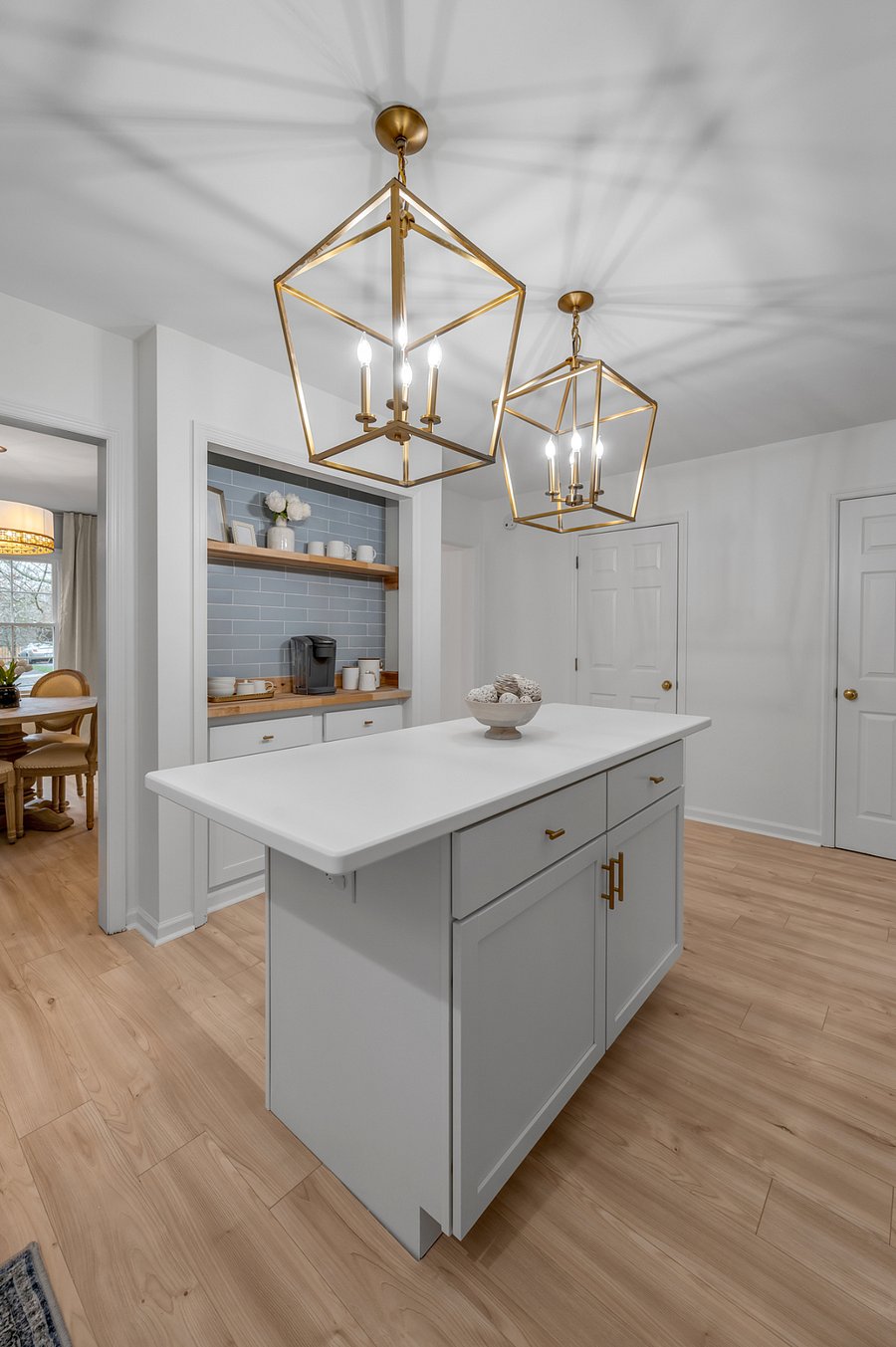 Coffee bar with view into dining room and door to walk-in pantry for plenty of storage