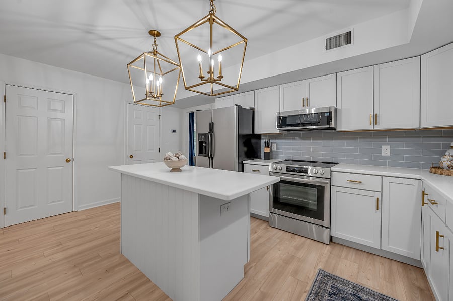 Kitchen with view of doors to walk-in pantry and utility closet