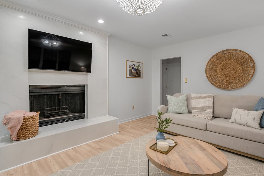 Mounted smart TV on the tiled fireplace so you can stream all of your favorite programs in this super comfortable room under a blanket