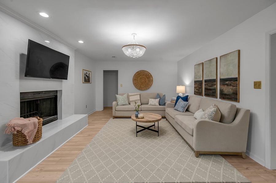 What's not to love about this living room?! View into hallway that leads to first floor master bedroom/bathroom on left side and garage on the right side.