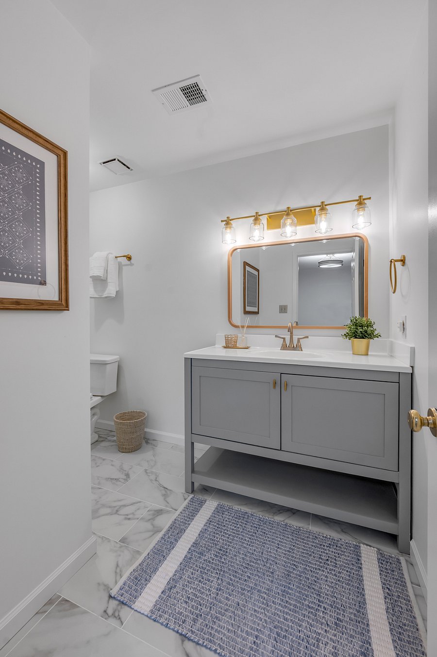 Vanity sink of completely remodeled rear 2nd level master bathroom. This bathroom also contains a large storage closet behind the bathroom door.