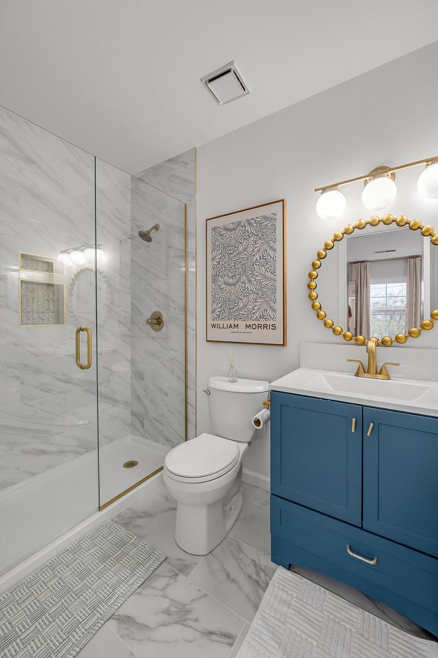First floor master bathroom has been completely renovated with new tile walk-in shower, toilet, tile floors, vanity and an adorable tiled alcove shelf to the side of the sink. And yes, we have towel hooks on the walls in all of these bathrooms. :)