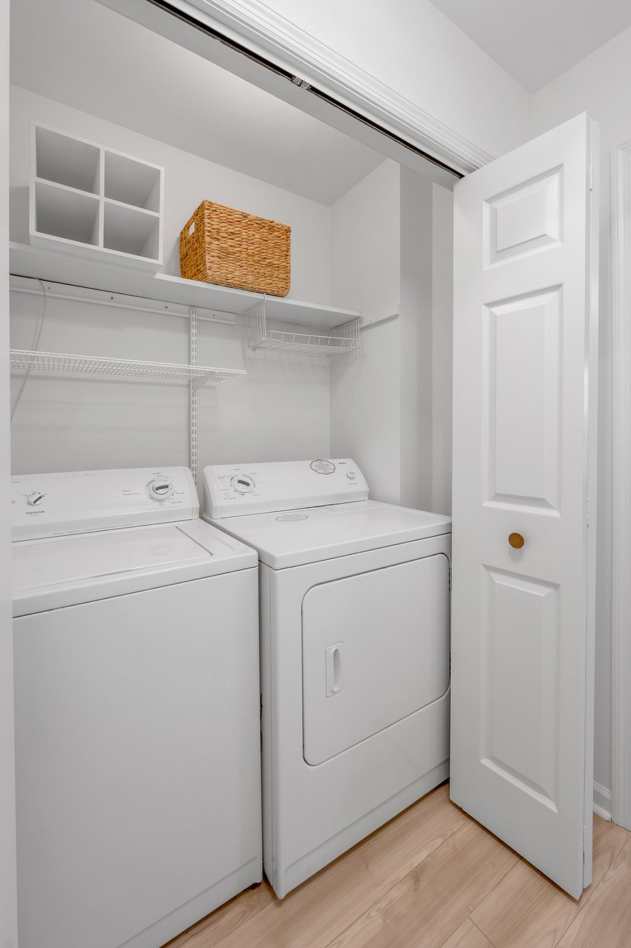 Laundry closet with washer and dryer in 2nd level hallway between the two upstairs master bedrooms