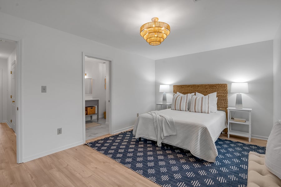 2nd level front master bedroom with view into completely remodeled full bathroom containing 60 inch vanity sink and bathtub/shower for those days you need a good soak in the bath.