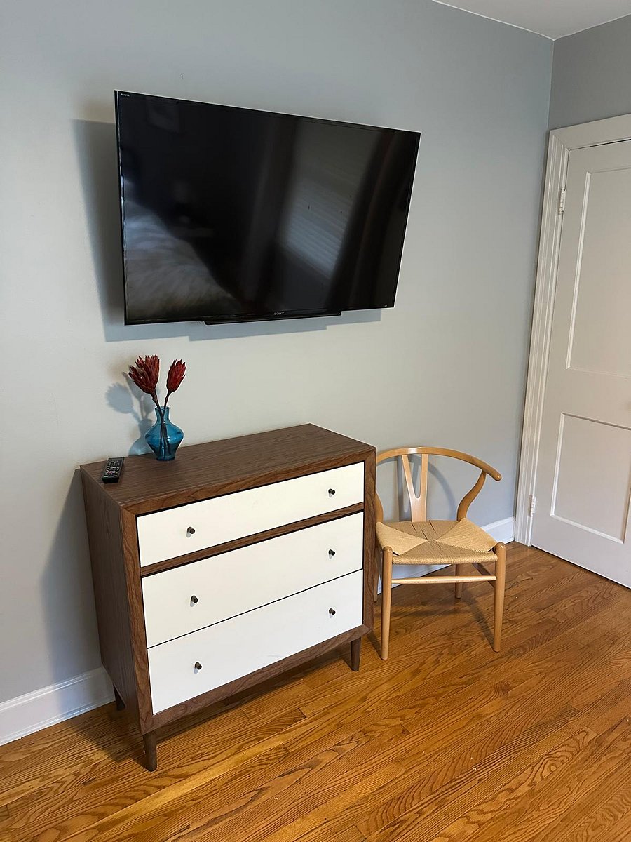 The primary bedroom has a TV that is viewable from the bed.