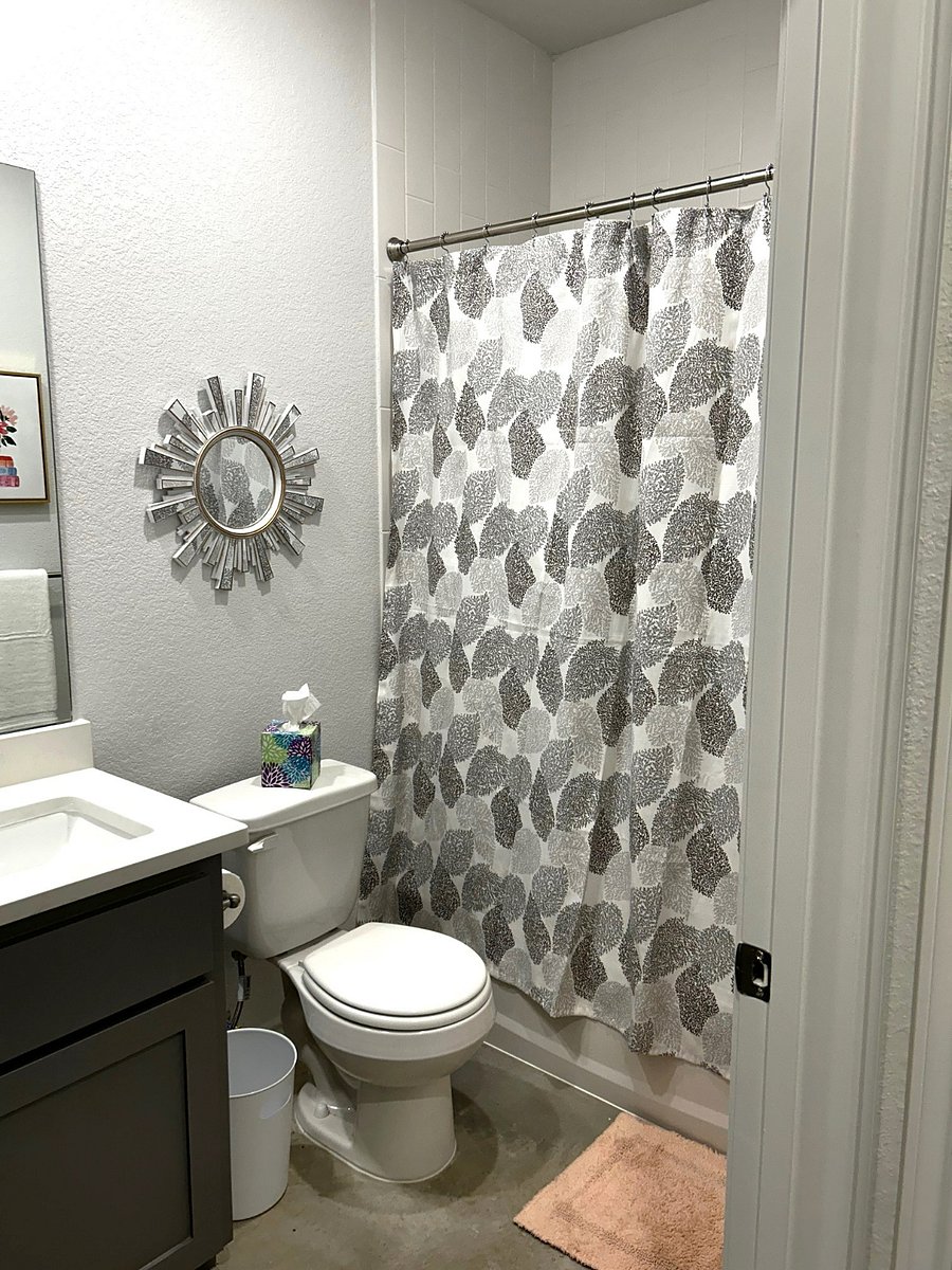 2nd bathroom, across the hall from bedrooms 2 and 3.