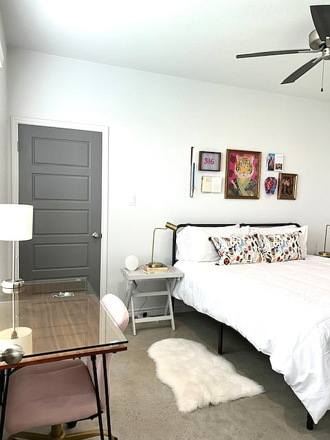 Primary bedroom with king bed and workspace. Door seen here to walk-in closet