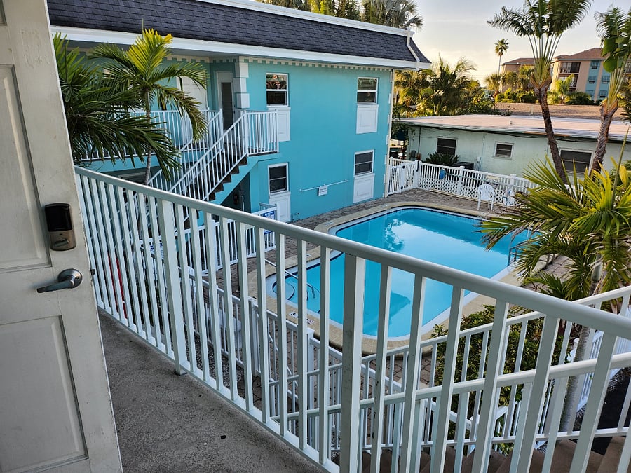 View of heated pool from unit entrance.
