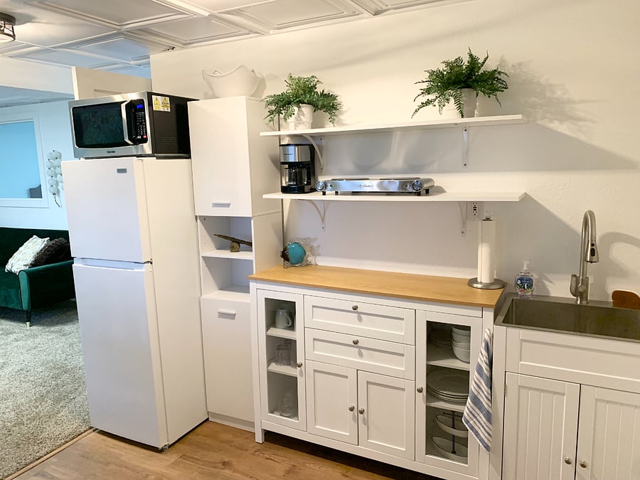 Kitchenette with full frig/freezer, food pantry, coffee maker, stove unit, sink, and microwave/convection oven unit plus all cooking essentials  